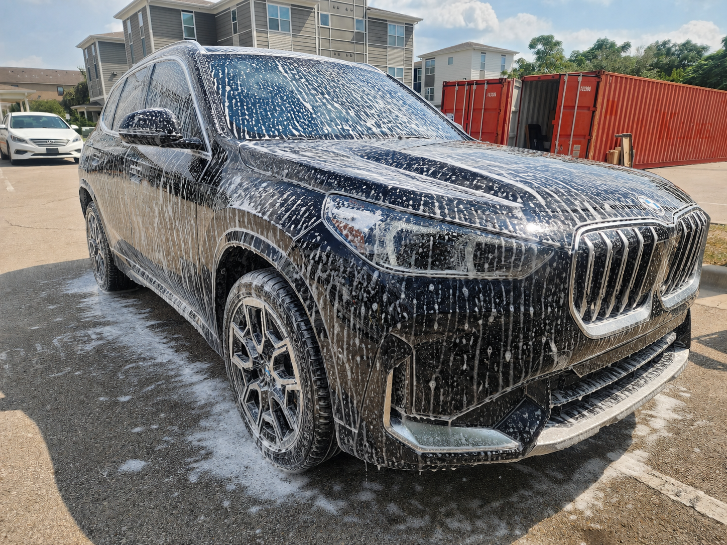 BMW X1 covered in car-wash foam