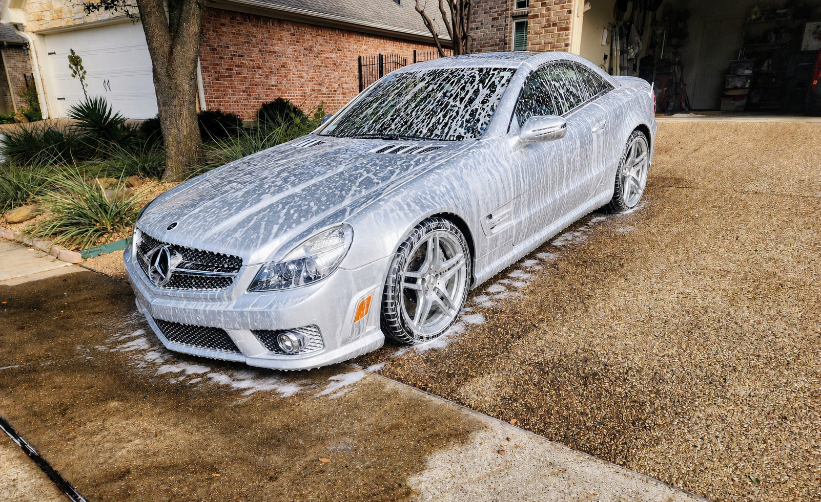 Mercedes SL covered in car-wash foam